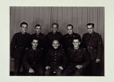 A 24: Photo/postcard size/landscape /black and white/ 7 brothers and father in uniform